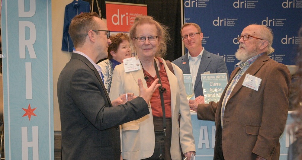 Attendee engaging with DRI staff at the DRI Hub