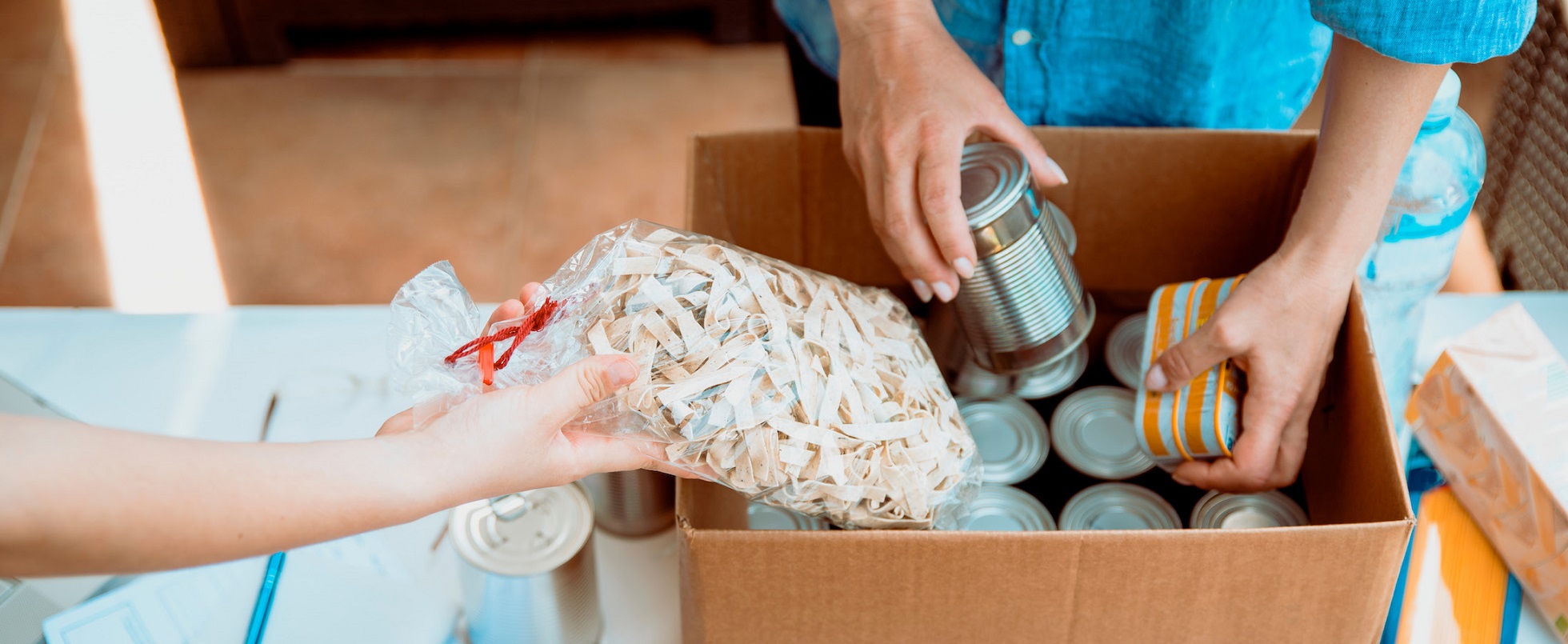 Packing food cans and items in a box