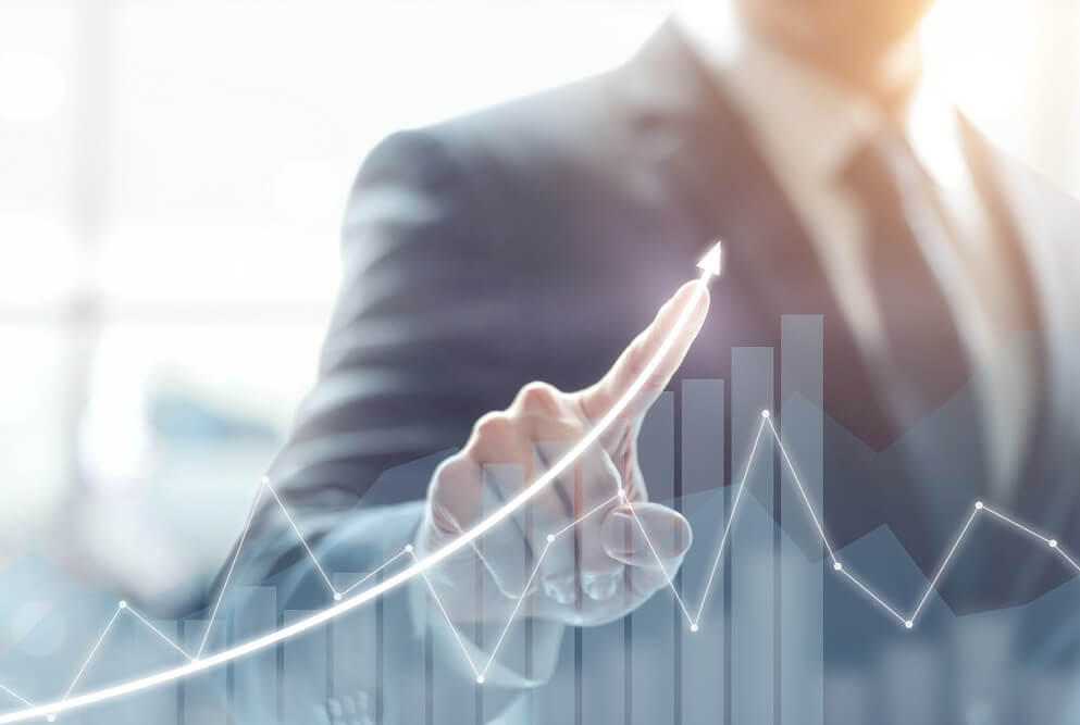 Person pointing at a chart projected