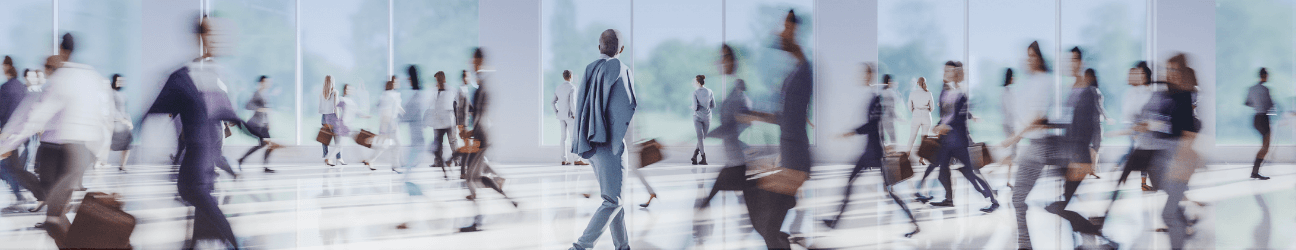 Fast-paced scene of business professionals walking through an office building