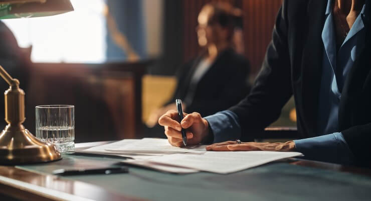 A jury taking notes in the courtroom
