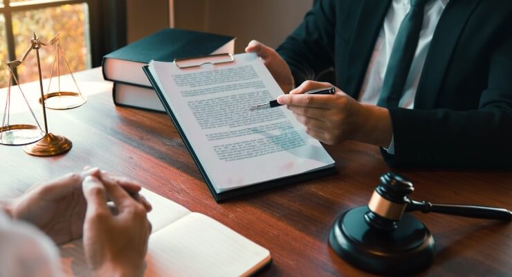 Lawyer showing contract to review and sign