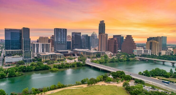 Austin skyline bridge yellow and orange sky